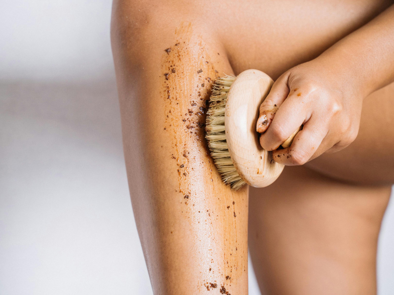 Image showing an exfoliating brush on leg